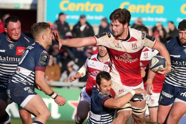Ulster's Iain Henderson is tackled by the Bordeaux-Begles' Louis Madaule and Ian Madigan