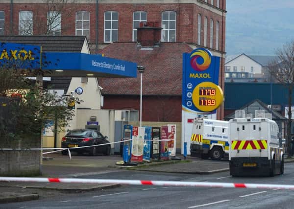 A north Belfast gun attack that injured a PSNI officer was a planned operation with automatic gunfire sprayed across a garage forecourt, the chief constable has said.  The attack took place on the Crumlin Road in Belfast.
Picture By: Arthur Allison/Pacemaker Press