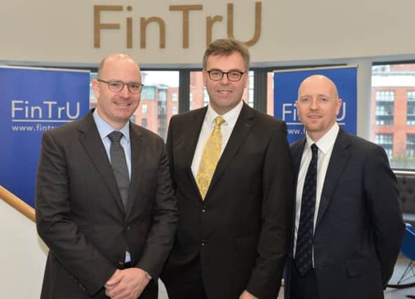 Fin TrU CEO Darragh McCarthy with Invest NI CEO Alastair Hamilton and Stephen Shaw, Fin TrU head in Belfast