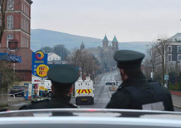 Officers manning the scene of the latest murder bid, a t a petrol station on the Crumlin Road, just a few hundred yards from the Ardoyne-Twaddell interface