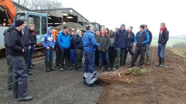 Level 3 Extended Diploma in Agriculture students discussing hedge planting with CAFRE Agri-Environment Training Adviser, Graeme Campbell