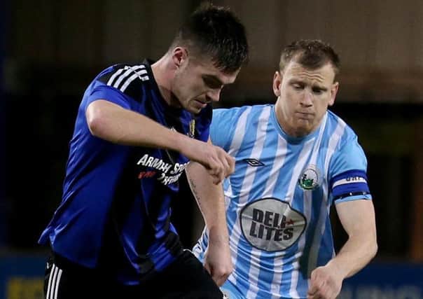 Warrenpoint's Liam Bagnall in action with Armagh's Sean Mallon
