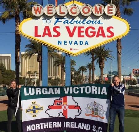 Julie-Anne and Jeff Magee proudly display their supporters club's banner in Las Vegas