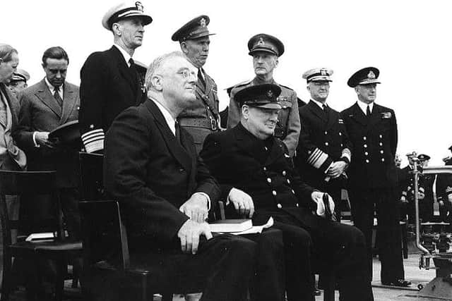 Sir John Dill, at the Placentia Bay Conference,held aboard HMS Prince of Wales, August 1941. He is behind President Roosevelt and Winston Churchill, facing towards the camera