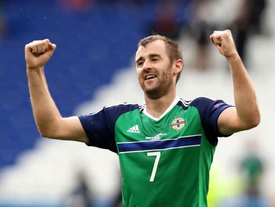 Northern Ireland winger Niall McGinn scored twice in Aberdeen's 3-0 win over Dundee on Friday evening.