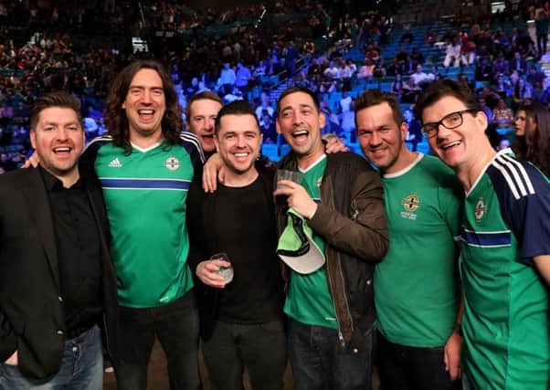 Snow Patrol's Gary Lightbody (second left), DJ

Pete Snodden (third left) and radio and TV presenter Colin Murray (fourth left) with Frampton fans at ringside