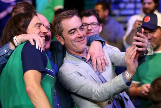James Nesbitt (right) and Gary Lightbody pose for a selfie with a Frampton fan in the MGM Grand