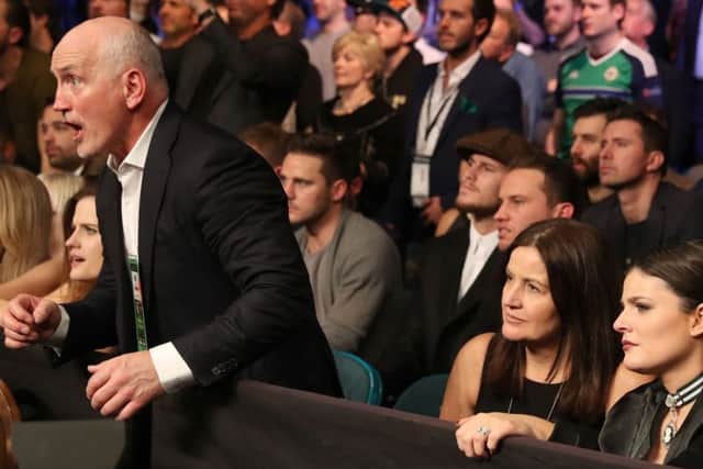 Barry McGuigan cuts a tense figure as he watches Frampton lose his rematch with Leo Santa Cruz