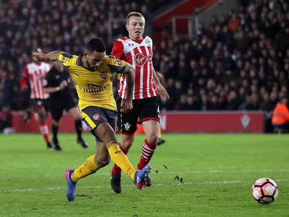 Theo Walcott netted a hat-trick against his former club