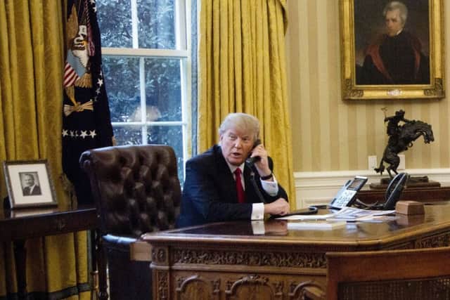 President Donald Trump speaks on the phone  in the Oval Office of the White House, which very few pundits thought he would reach this time last year. Yanis Varoufakis says Mr Trump ticks a lot of things that are needed in a politician but he is still terrible because he then does the wrong thing in office (AP Photo/Manuel Balce Ceneta)