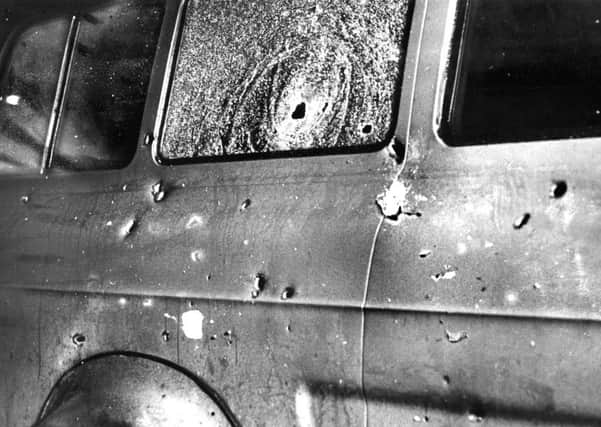 The bullet-riddled minibus at the scene of the massacre of 10 protestant workman shot dead by the provisional IRA at Kingsmill