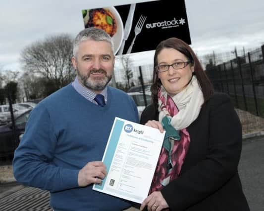 Eurostock Foods (NI) Ltd Group Managing Director Gary White and Technical Manager Arlene McEvoy display the company's Certificate of Conformity Â©Edward Byrne Photography