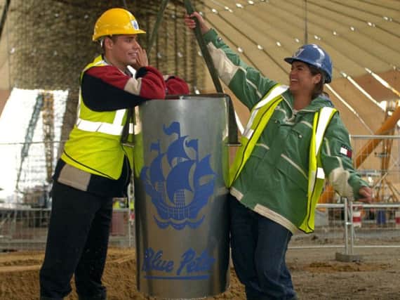 File photo dated 11/06/98 of Blue Peter presenters Richard Bacon and Katy Hill with the Blue Peter time capsule, as the O2 Arena has promised to help rebury the millennium time capsule unearthed by builders, and damaged, 33 years early