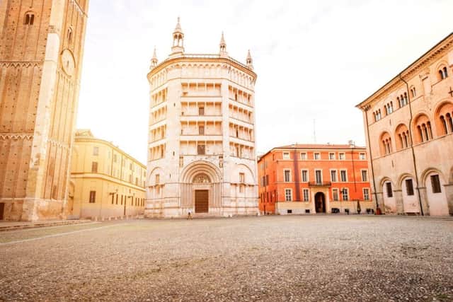 Parma cathedral with Baptistery leaning tower on the central square in Parma town in Italy