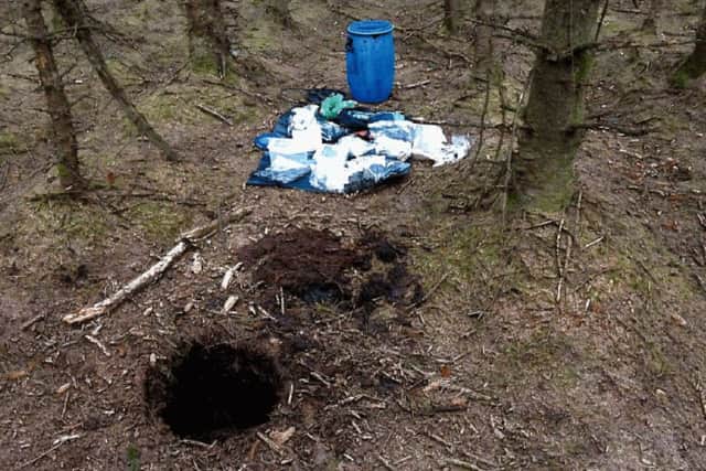 Barrel containing weapons which were recovered in woodland at Capanagh Forest