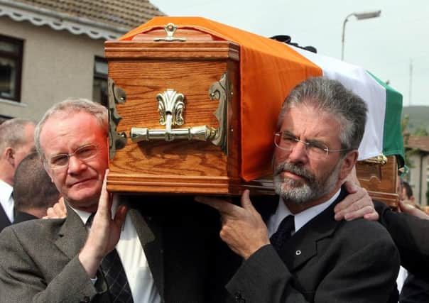 Sinn Fein President Gerry Adams (right) and Martin McGuinness carrying the coffin of former senior IRA commander Brian Keenan in west Belfast in 2008. Photo: Paul Faith/PA Wire
