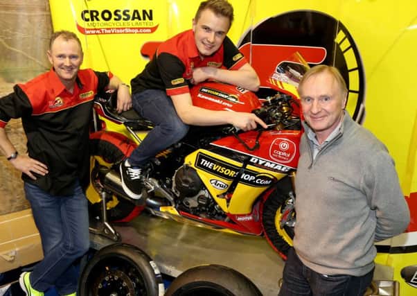 Simon Reid with his  father and former double world champion Brian (right), and new sponsor Adrian Fegan of Crossan Motorcycles.