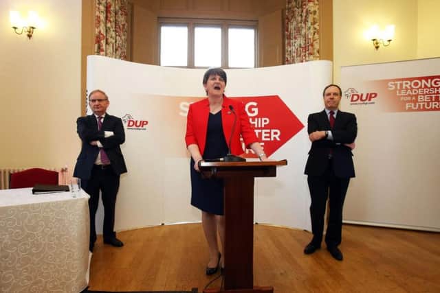 DUP leader Arlene Foster, flanked by deputy leader Nigel Dodds MP (right) and party chairman Lord Morrow (left).
