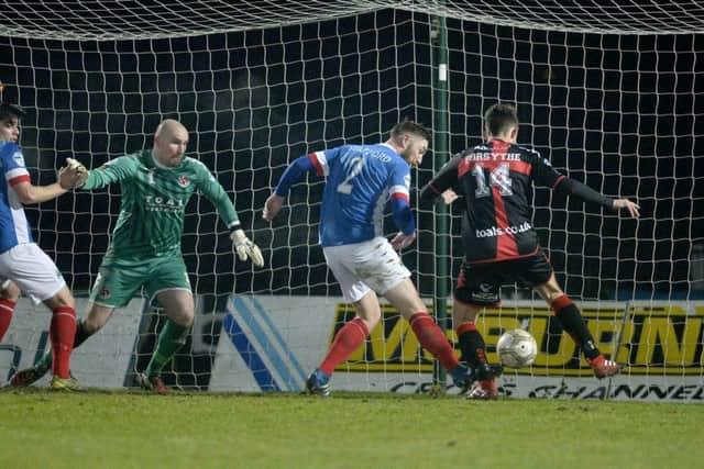 Linfield's Mark Stafford pokes home at the back post to make it 2-0 to the Blues. (
Photograph by Presseye/Stephen Hamilton)
