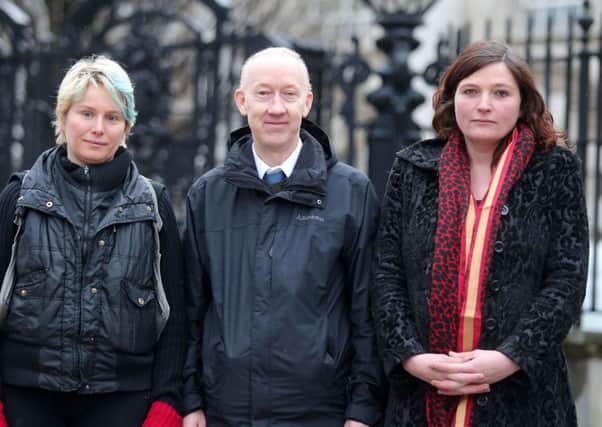 Kate Wilson, Jason Kirkpatrick and Kim Bryan pictured outside the High Court in Belfast after winning the first stage of the legal battle
