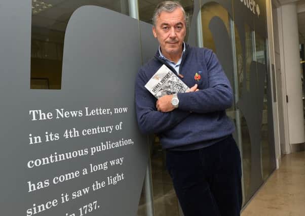 Author William Matchett in 2016 at the News Letter with his book about the IRA.
Photo Colm Lenaghan/Pacemaker Press