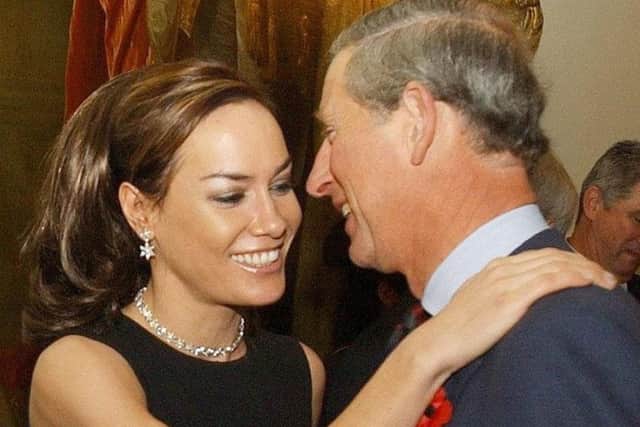 The Prince of Wales is geeted by Tara Palmer Tomkinson during a reception at Clarence House, London, in 2003