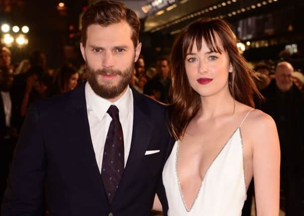File photo dated 12/02/15 of Jamie Dornan and Dakota Johnson who will add some much-needed heat to a cold London evening at the UK premiere of their new film Fifty Shades Darker