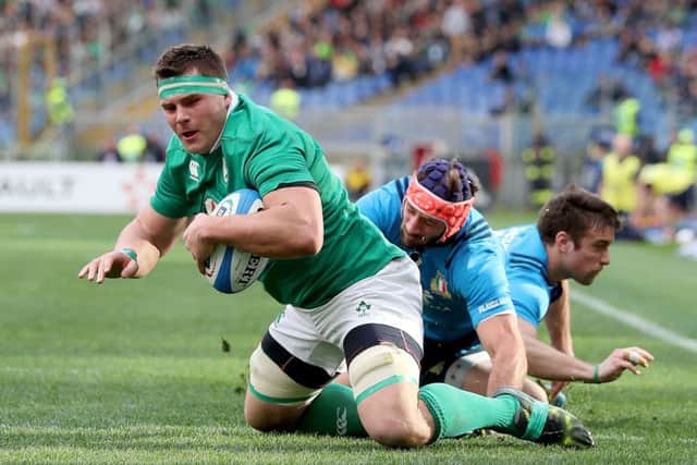 Ireland's CJ Stander scores the first of his three tries despite Angelo Esposito of Italy