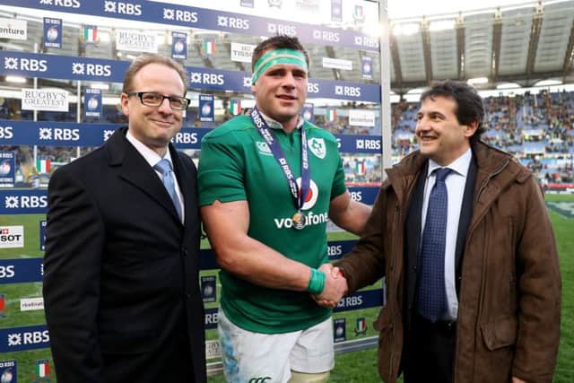 Ireland's CJ Stander who scored three tries receives the RBS Man of the Match award from RBS prize winner Umberto Vallarino and Peter Ryan-Bell of RBS