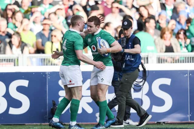 Ireland's Keith Earls celebrates scoring their third try with Paddy Jackson