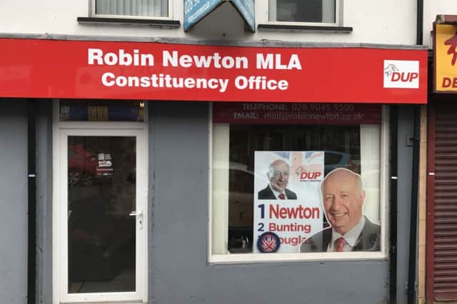 The posters have been prominently displayed in the window of Mr Newtons taxpayer-funded office  in breach of Assembly rules