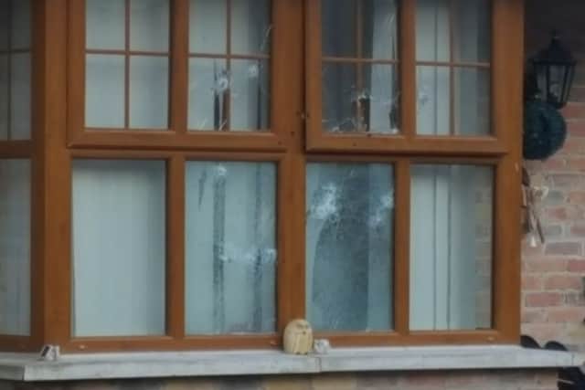 Front window of house in Carrigart Crescent is riddled with gunshots
