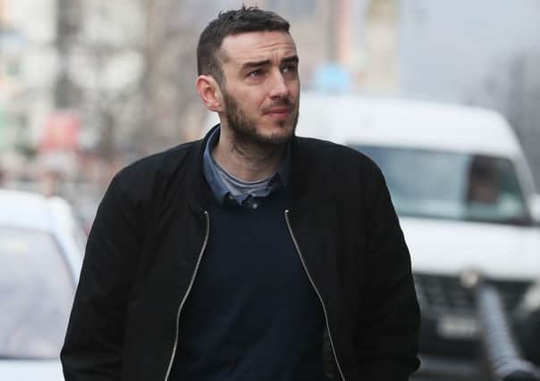 Eamon Bradley, 28, from Londonderry, who is accused of terrorism charges linked to the Syrian civil war, arriving at the city's Crown Court where he denies six charges, including attending a terrorist training camp and receiving training in the use of a grenade