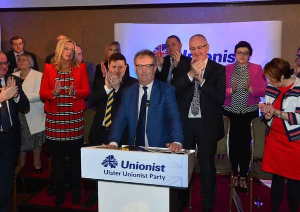 Mike Nesbitt is applauded by party supporters and Assembly candidates during the launch of the UUP election manifesto