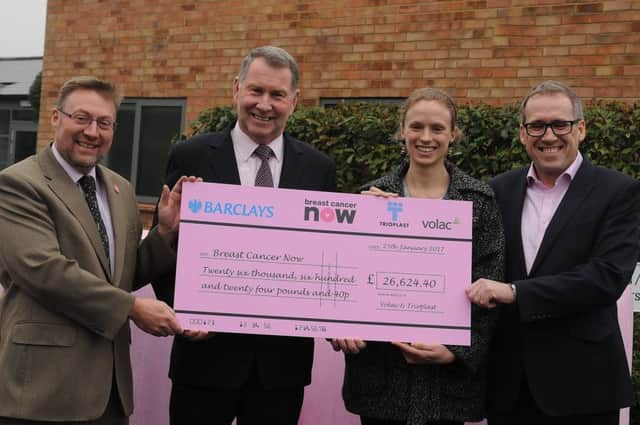 Volac animal nutrition managing director David Neville, left, joins Volac NI manager Alistair Sampson and Jim Davidson, right, Trioplast MD, in presenting Lorna Thomas of Breast Cancer Now with Â£26,624.40 from last years pink silage bale campaign. In 2017 farmers, contractors and merchants can again help fund breast cancer research and increase awareness of this condition by using pink big bale wrap from Volac.