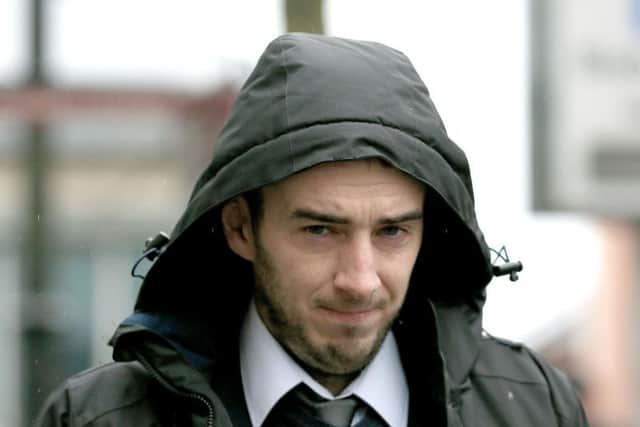 Syrian terrorism accused Eamon Bradley, 28, from Londonderry, leaves the city's Crown Court after being found not guilty of possessing explosives, but a jury has been unable to return a verdict on whether he attended a terrorism camp