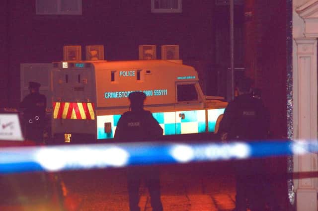 Police attend the scene of the shooting in the Beechmount area of west Belfast. Pic: Samuel Severn / Pacemaker Press