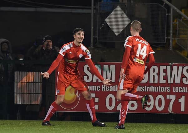 Celebration time for Cliftonville following Daniel Hughes' equaliser against Glentoran. Pic by Pacemaker.