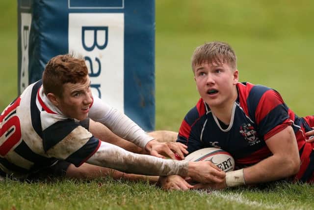 Ballymena Academy Stewart Moore scores a try against  Wallace High