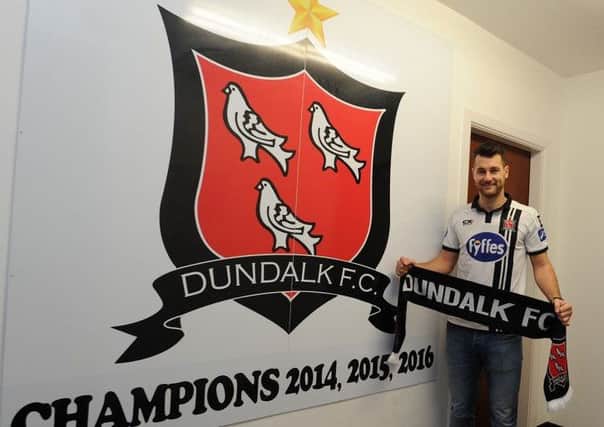 Thomas Stewart showing off his club colours after signing a deal with League of Ireland champions Dundalk.