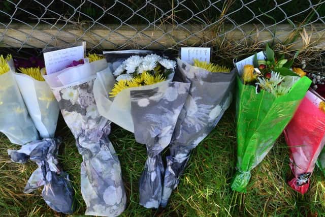 Floral tributes have been laid close to the lane at Sprucefield where Ryan Phillips was killed on Sunday evening. Picture by Arthur Allison, Pacemaker Press.