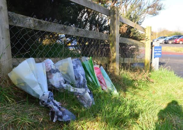 Floral tributes left at Sprucefield park and ride, close to where Lisburn man Ryan Phillips (27) was killed in a scrambler crash on Sunday evening. Picture by Arthur Allison, Pacemaker Press