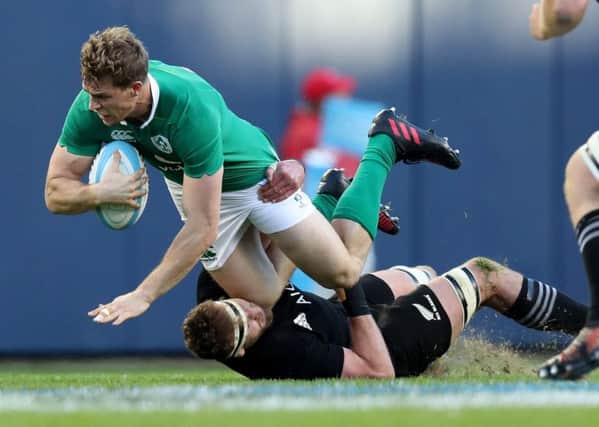 Irelands Andrew Trimble is tackled by New Zealand All Blackss Sam Cane
 Â©INPHO/Billy Stickland