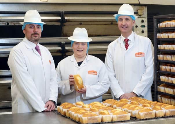 Ian Sheppard, regional director NI Bank of Ireland UK, right, with Lois Graham, financial director at Grahams Bakery and Chris Gibb, business development manager at the bank