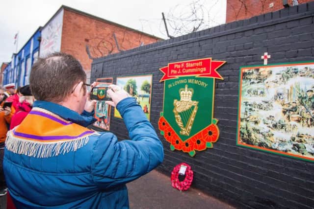 A wall mural is unveiled in east Belfast by Ulster Defenders of the Realm LOL 710 in memory of murdered UDR soldiers, Fred Starrett and James Cummings, prior to the memorial parade and service of remembrance in the city centre on 25-02-17
.