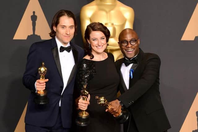 Jeremy Kleiner Adele Romanski, and Barry Jenkins with the award for Best Picture for Moonlight