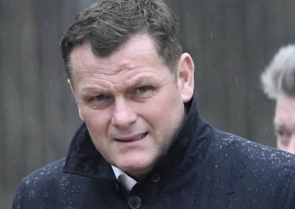Jim Magilton denies the charges of assaulting his stepdaughter