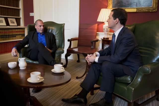 Pro austerity then UK Chancellor of the Exchequer George Osborne, right, with Greeces anti-austerity then finance minister Yanis Varoufakis at 11 Downing Street in London on Monday February 2, 2015.  Varoufakis had secured backing from France for his country's bid to renegotiate its debt during discussions in Paris, where he began a tour, meeting European counterparts. Photo: Matt Dunham/PA Wire