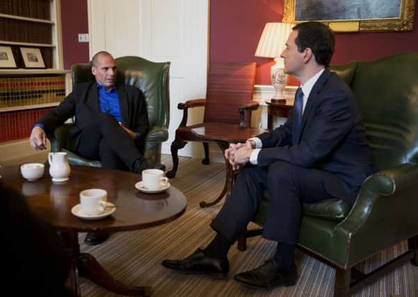 Pro austerity then UK Chancellor of the Exchequer George Osborne, right, with Greeces anti-austerity then finance minister Yanis Varoufakis at 11 Downing Street in London on Monday February 2, 2015.  Varoufakis had secured backing from France for his country's bid to renegotiate its debt during discussions in Paris, where he began a tour, meeting European counterparts. Photo: Matt Dunham/PA Wire