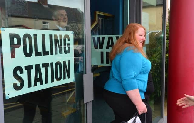 Alliance Party leader Naomi Long pictured at St Colmcilles Parish Church with husband Michael as they cast their vote.  
Picture By: Arthur Allison. Pacemaker